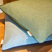 Herringbone tweed dog cushions in green and blue tweed designs  